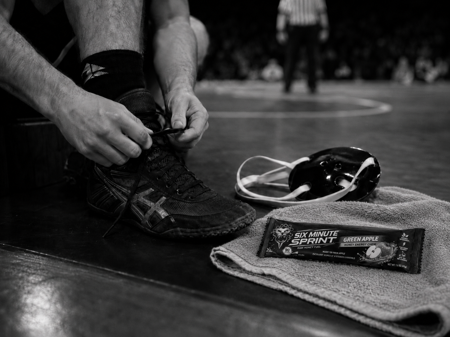Athlete tying shoes with Green Apple Chew nearby