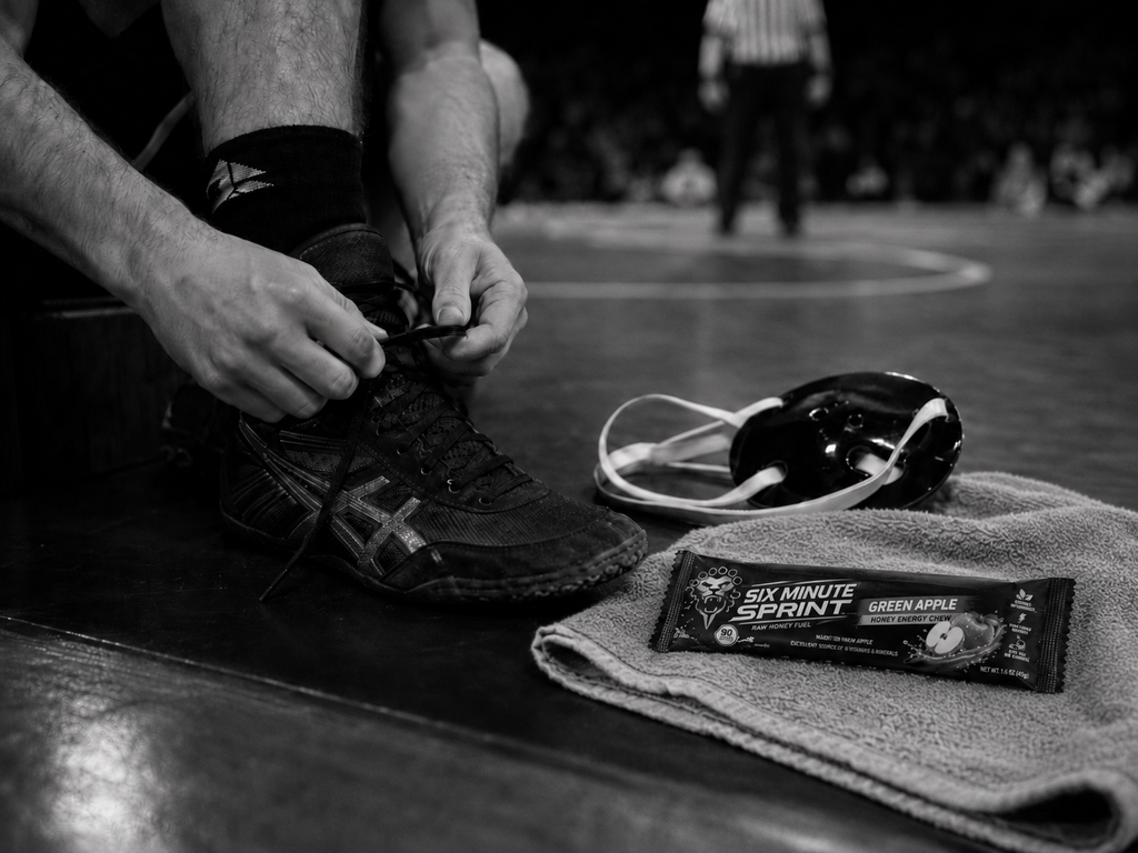 Athlete tying shoes with Green Apple Chew nearby