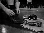 Athlete tying shoes with Green Apple Chew nearby
